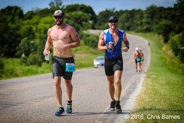 Runners race to the top of a hill at the 2016 Tulsa Triathlon